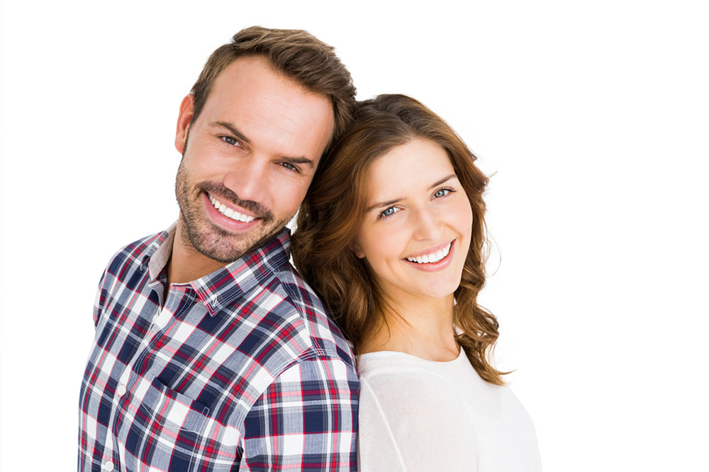 man and woman smiling after teeth whitening
